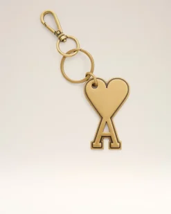 Ami de Coeur Schlüsselanhänger aus goldfarbenem Metall Gelb Unisex GebüRstetes