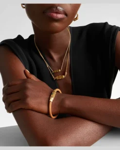Armreif Lasso aus Leder mit 18kt Gelbgold und Smaragd
