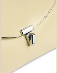 Clutch mini T-Lock aus Leder Beige