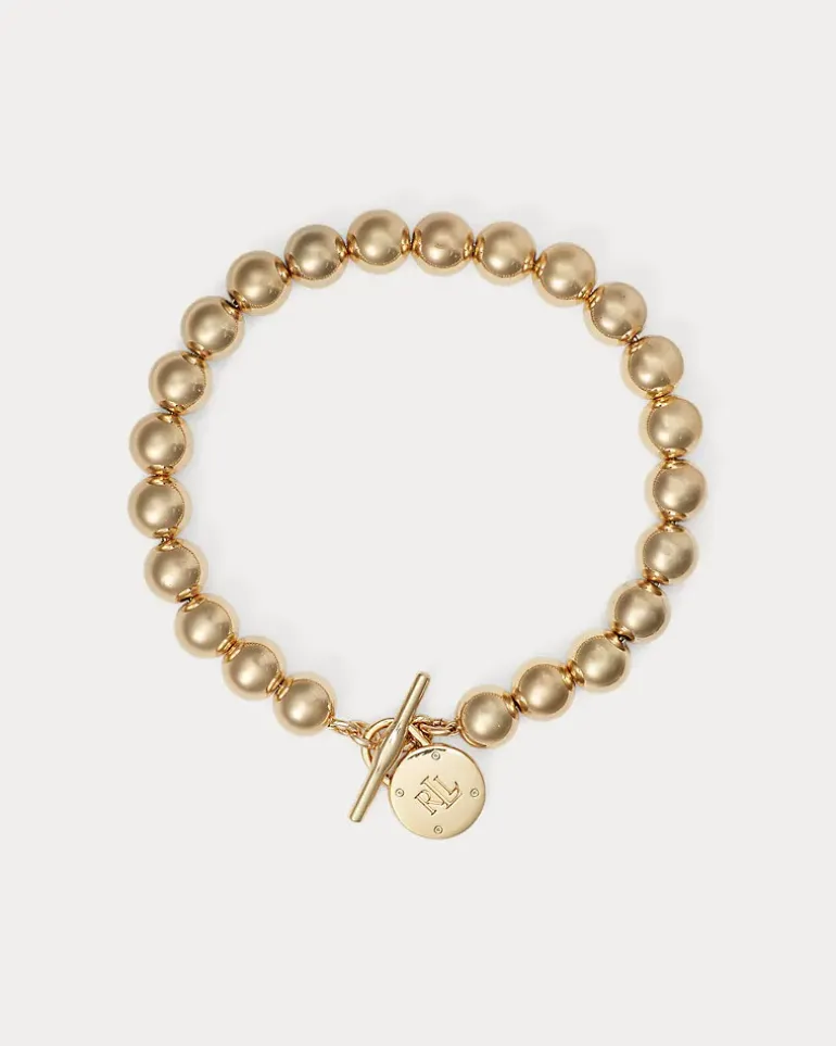 Goldfarbenes Perlenarmband mit Knebel