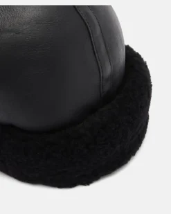 Mütze aus Leder mit Shearling Schwarz